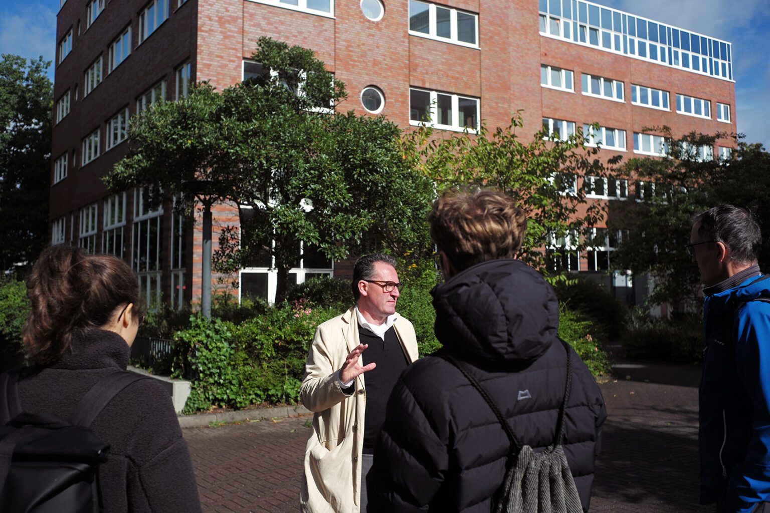 people listen attentively to the Science City Tour guide